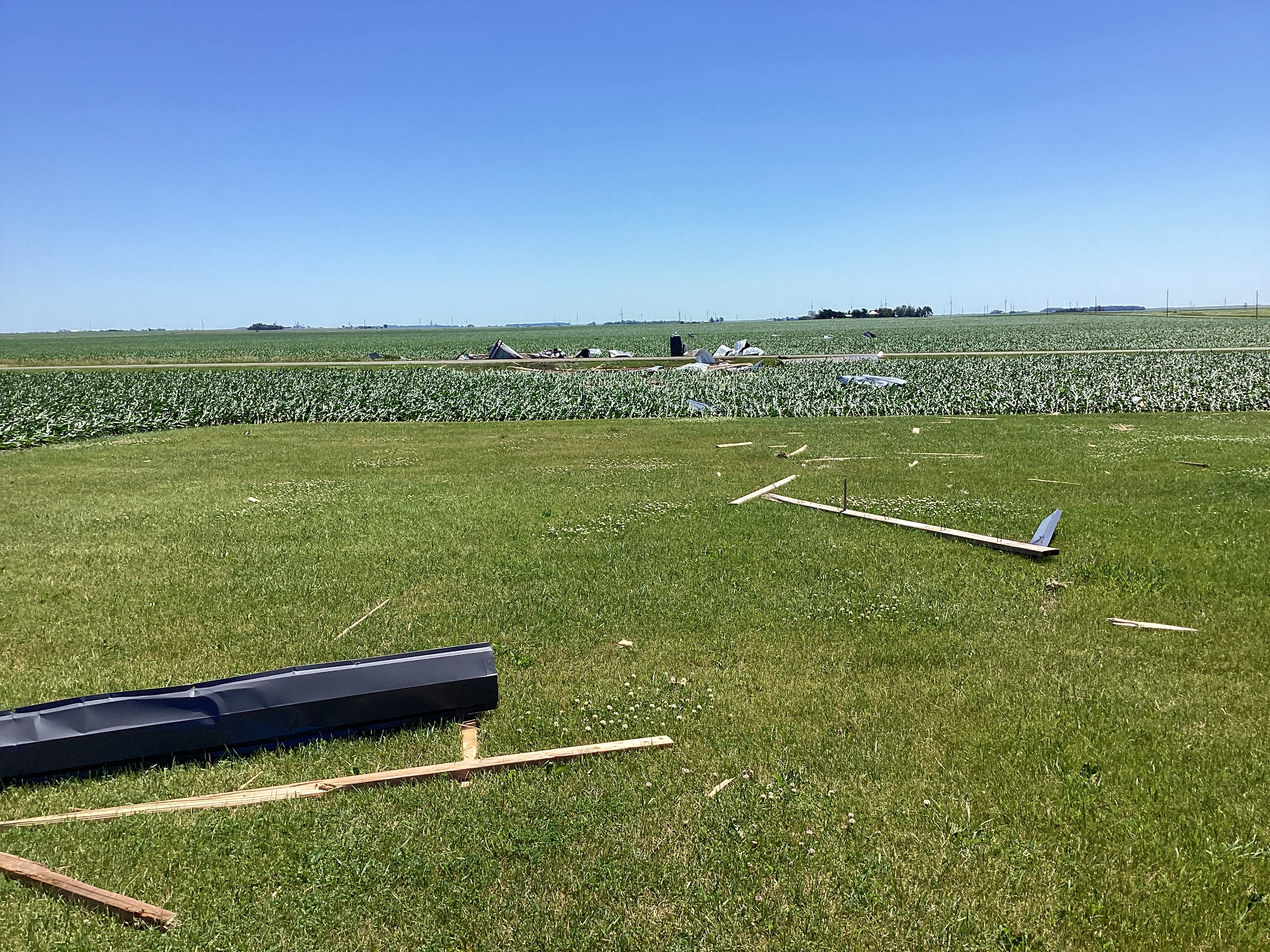 Debris from machine shed blown into nearby field