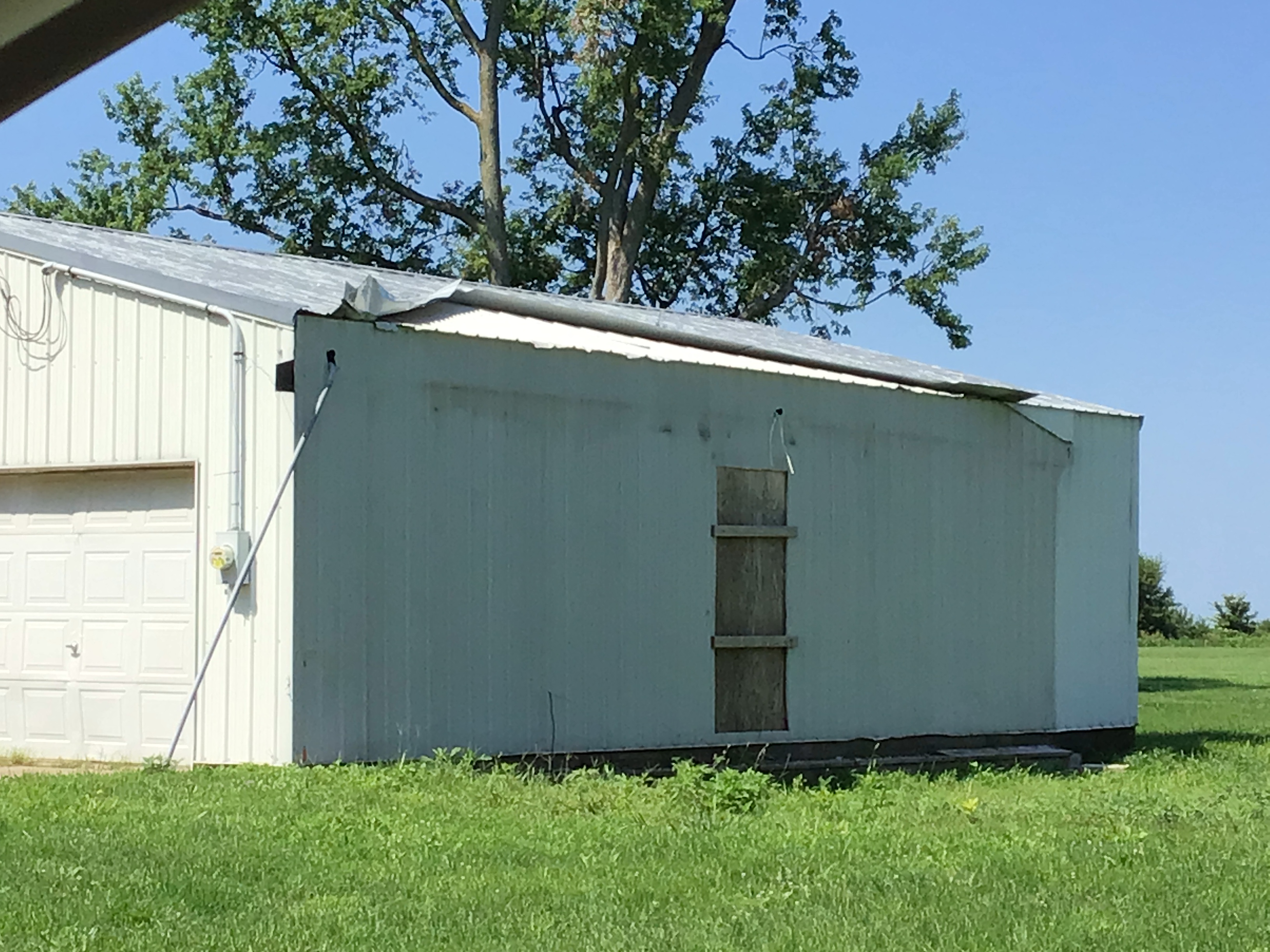 Outbuilding roof damage in Monica